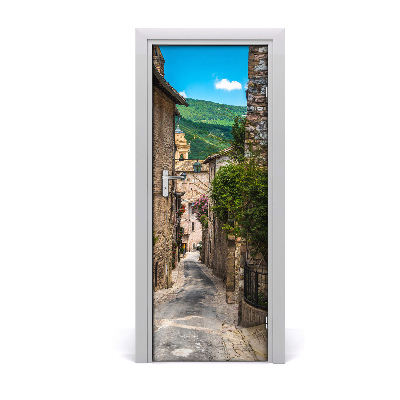 Ajtó tapéta Bájos utca zöld dombokkal