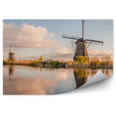 Fotótapéta Szélmalmok tükörképe a vízi tájon