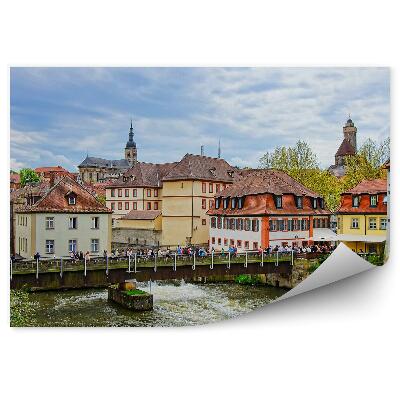 Öntapadós fotótapéta Régi házak folyó központ híd turisták