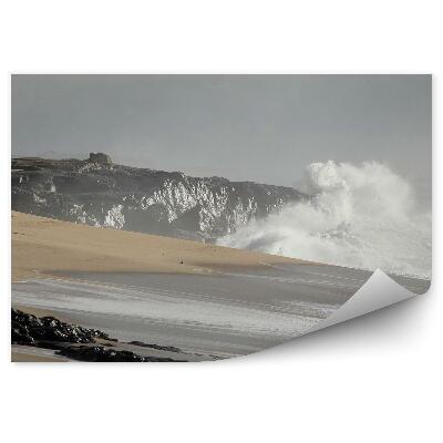 Poszter tapéta Vihar a parton sziklák emberek