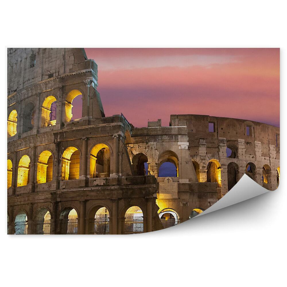 Fotótapéta A megvilágított Colosseum a háttérben a színes égbolt