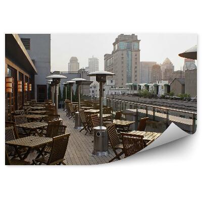 Öntapadó fotótapéta Épületek terasz székek asztalok lámpák égbolt