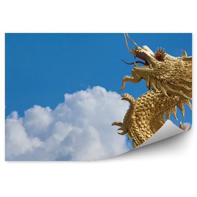 Öntapadós fotótapéta Arany sárkány repül a felhők között a kék égen