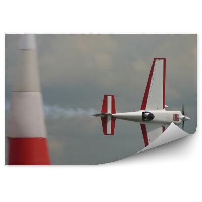 Öntapadó fotótapéta Repülőgép oldalra repül a felhős égen