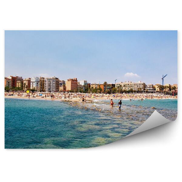 Fotótapéta strand kövek emberek épületek égbolt Barcelona