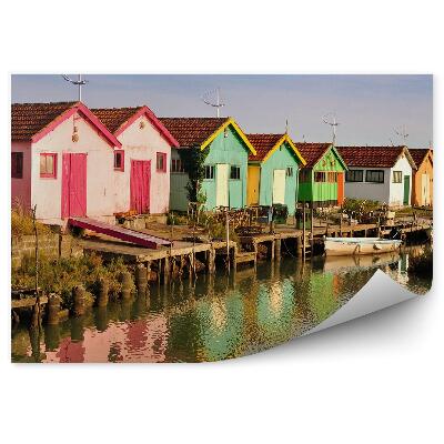 Öntapadó fotótapéta Színes épületek hajó híd tó égbolt felhők