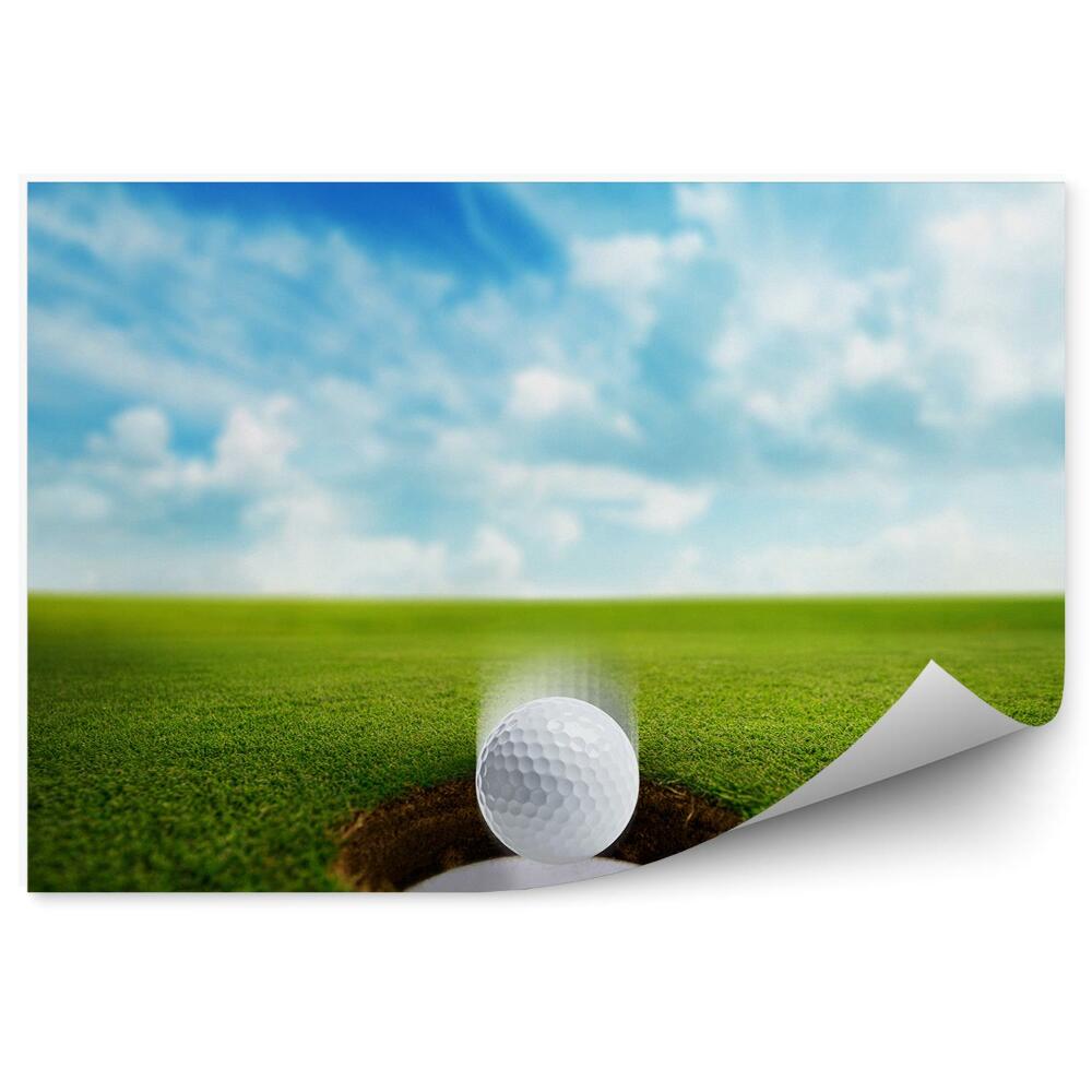Fotótapéta Lyukas golflabda ég felhők fű
