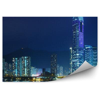Fotótapéta A hongkongi felhőkarcolók megvilágítják az óceán éjszakáját