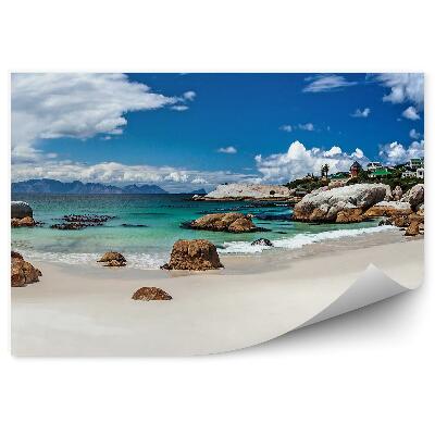 Öntapadós fotótapéta falra Hegyek sziklák város strand óceán égbolt felhők