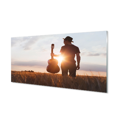 Férfi a réten egy gitárral Üvegkép falra