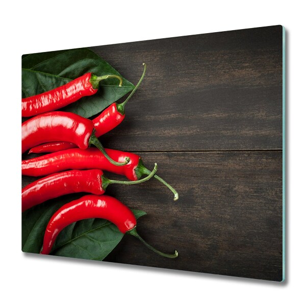 Tűzhelyvédő Üveglap Chili paprika egy fából készült deszkán